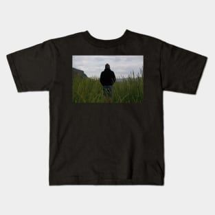 Lonely man in the grass Kids T-Shirt